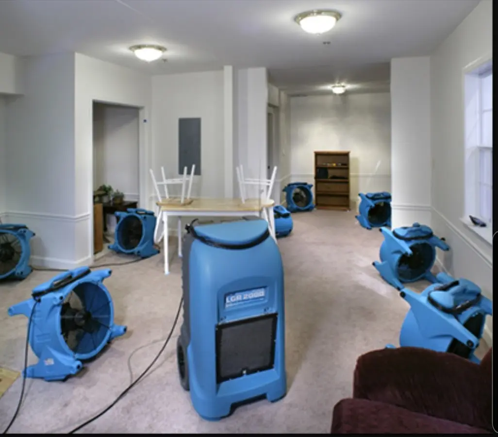 Air movers and dehumidifier setup for Water Damage Restoration in West Livingston